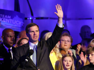 Then Governor-Elect Andy Beshear celebrates with supporters after voting results showed him holding a slim lead over Republican Gov. Matt Bevin on November 5, 2019, in Louisville, Kentucky.