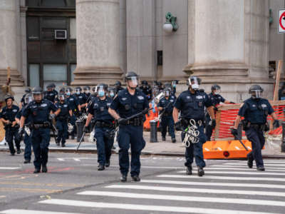 Police officers approach protesters near City Hall on July 1, 2020, in New York City.