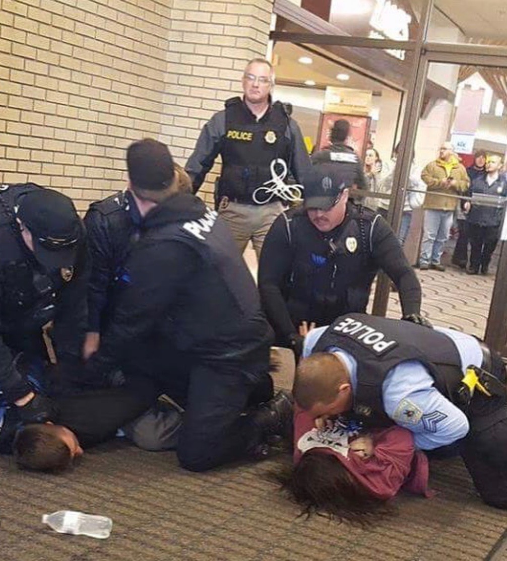 Taino Water Protector Karla Colon being taken down at one of her two arrests. This one was at the Kirkwood Mall in Bismarck on Black Friday, 2016.