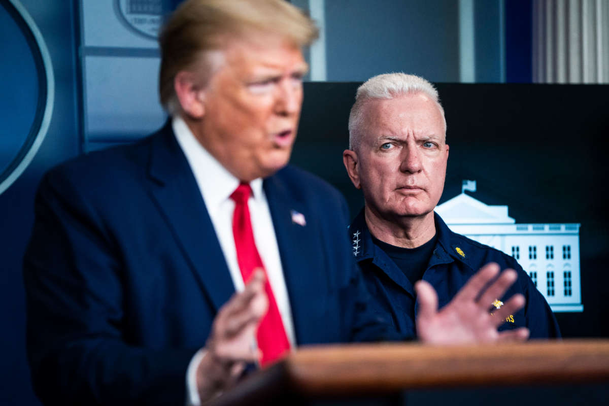 Admiral Brett Giroir, assistant secretary of Health and Human Services, listens as President Trump speaks during a briefing in response to the COVID-19 pandemic in the James S. Brady Press Briefing Room at the White House on April 6, 2020, in Washington, D.C.
