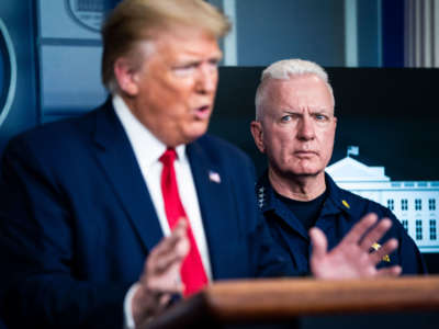 Admiral Brett Giroir, assistant secretary of Health and Human Services, listens as President Trump speaks during a briefing in response to the COVID-19 pandemic in the James S. Brady Press Briefing Room at the White House on April 6, 2020, in Washington, D.C.