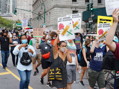 Black Lives Matter, United Federation of Teachers, the Democratic Socialists of America, and other groups gathered on the National Day of Resistance to protest against reopening of schools as well as police-free schools on August 3, 2020, in New York City.