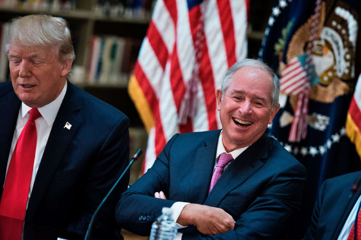 Stephen A. Schwarzman, CEO of the Blackstone Group laugs before a meeting with President Trump and others in the Eisenhower Executive Office Building on the White House campus, April 11, 2017, in Washington, D.C.