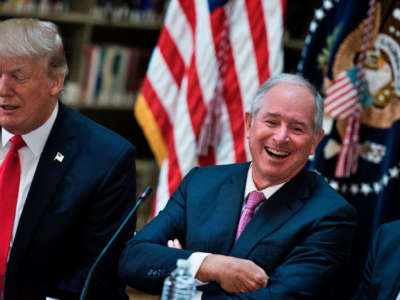 Stephen A. Schwarzman, CEO of the Blackstone Group laugs before a meeting with President Trump and others in the Eisenhower Executive Office Building on the White House campus, April 11, 2017, in Washington, D.C.