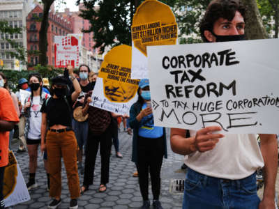 People participate in a "March on Billionaires" event on July 17, 2020, in New York City.