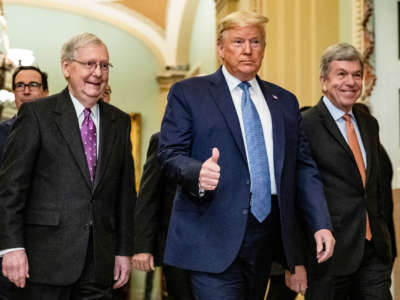 President Trump arrives at the U.S. Capitol to attend the Republicans weekly policy luncheon on March 10, 2020, in Washington, D.C. He is flanked by Senate Majority Leader Mitch McConnell and Republican Policy Committee Chairman Senator Roy Blunt.