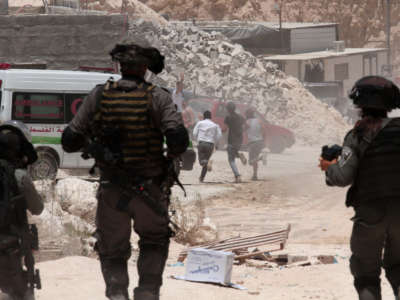 Israeli security forces intervene with Palestinian demonstrators after they staged a counter protest against the Jewish settlers camping on a hill in the town of Beita, near Nablus, West Bank, on July 18, 2020.