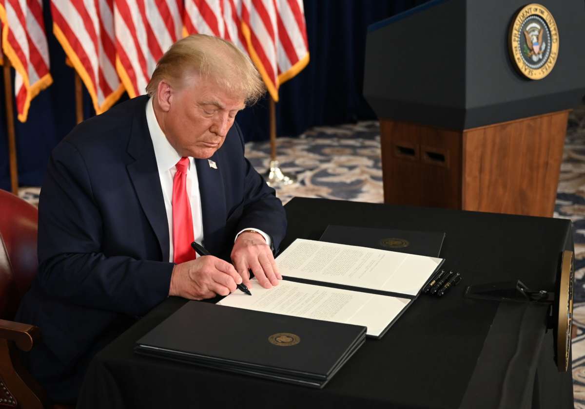 Donald Trump signs an executive order