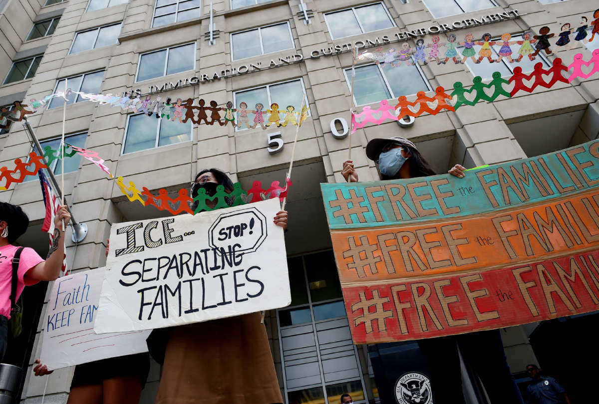Demonstrators protest outside the Immigration and Customs Enforcement (ICE) headquarters to demand the release of immigrant families in detention centers at risk during the coronavirus pandemic, in Washington, D.C., on July 17, 2020.