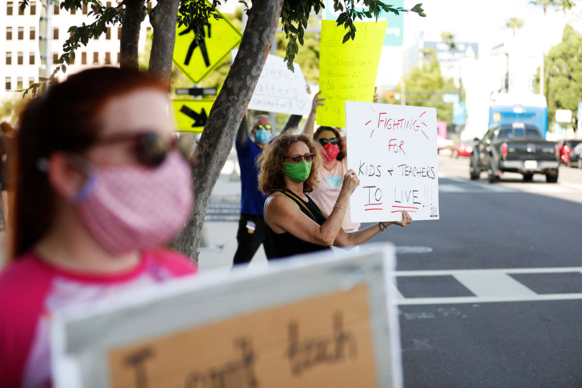 Teachers who oppose schools reopening during the COVID-19 pandemic protest on August 6, 2020, in Tampa, Florida.