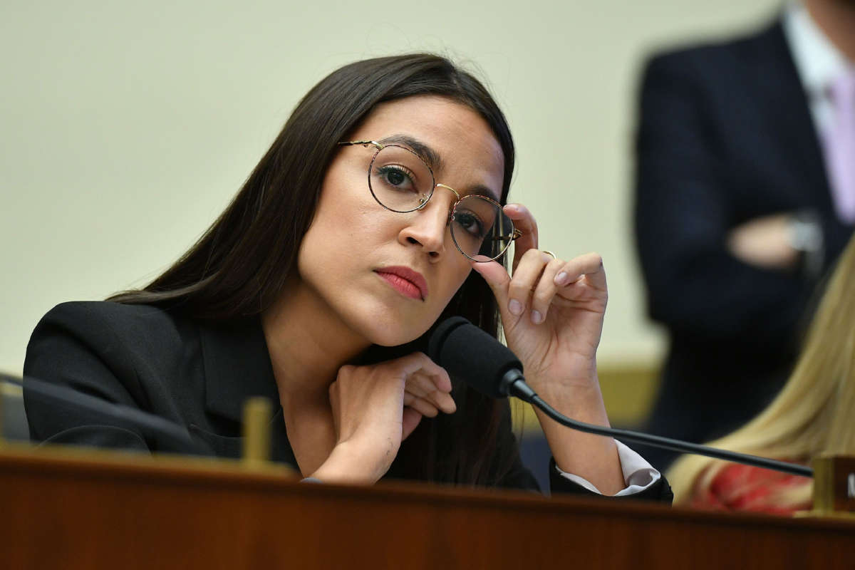 Rep. Alexandria Ocasio-Cortez listens during a House Financial Services Committee in the Rayburn House Office Building in Washington, D.C. on October 23, 2019.