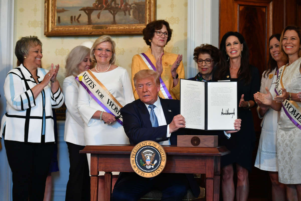 President Trump takes part in the signing of a proclamation on the 100th anniversary of the ratification of the 19th Amendment during an event in the Blue Room of the White House in Washington, D.C. on August 18, 2020.