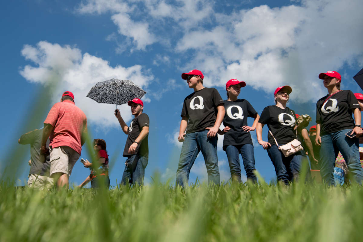 Supporters of President Donald Trump wearing 'QAnon' t-shirts wait in line before a campaign rally at Freedom Hall on October 1, 2018, in Johnson City, Tennessee.