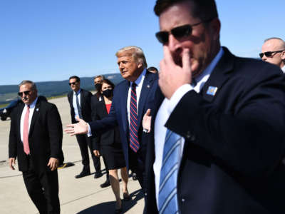 President Trump walks to greet supporters upon arrival at Wilkes-Barre Scranton International Airport in Avoca, Pennsylvania, August 20, 2020.