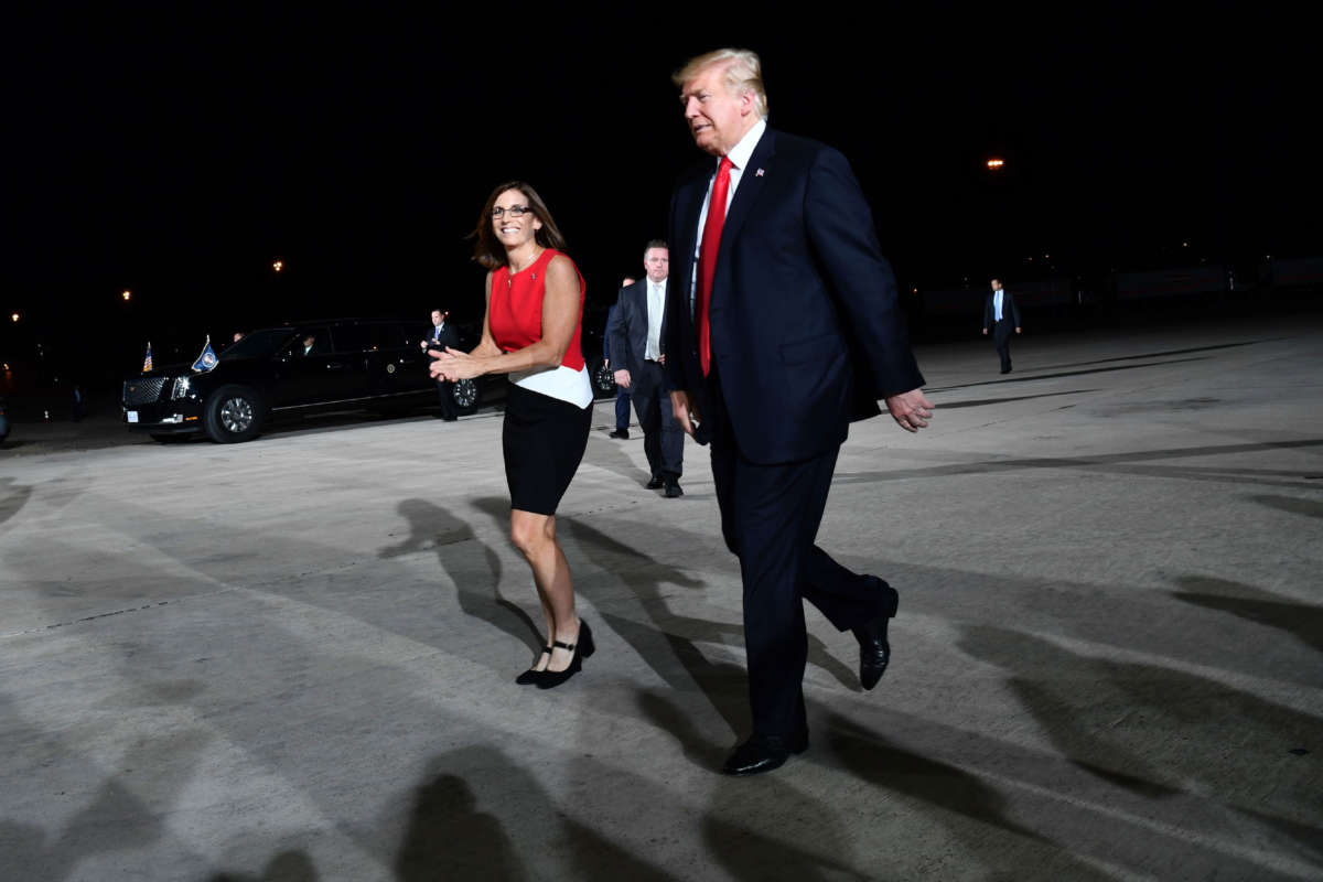 Then-Rep. Martha McSally and President Trump arrive at a rally in Mesa, Arizona, on October 19, 2018.