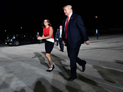 Then-Rep. Martha McSally and President Trump arrive at a rally in Mesa, Arizona, on October 19, 2018.