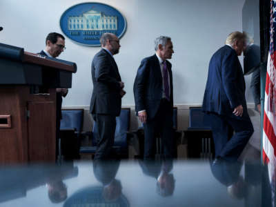 From left, Secretary of the Treasury Steven Mnuchin, Director of the Office of Management and Budget Russell Vought, member of the coronavirus task force Scott Atlas, and President Trump leave after a briefing at the White House August 10, 2020, in Washington, D.C.