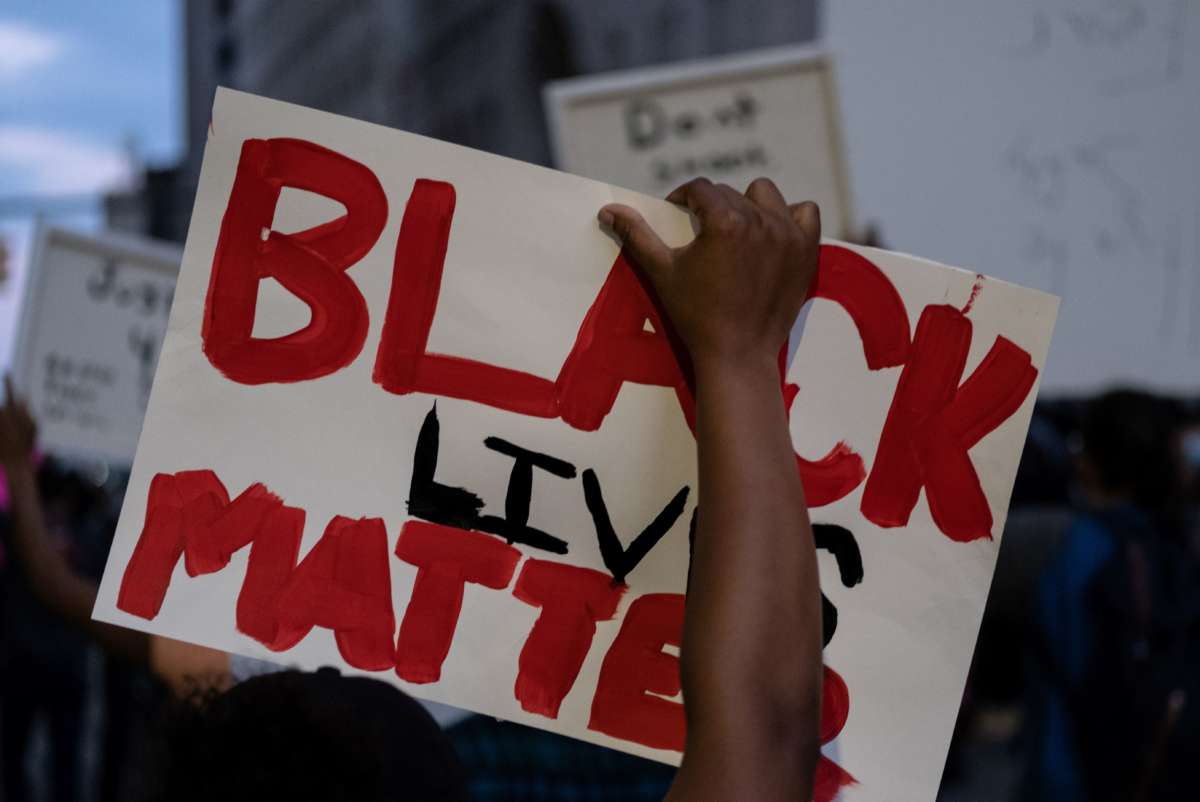 A person holds up a placard that reads "Black Lives Matter" during a protest in the city of Detroit, Michigan, on May 29, 2020.