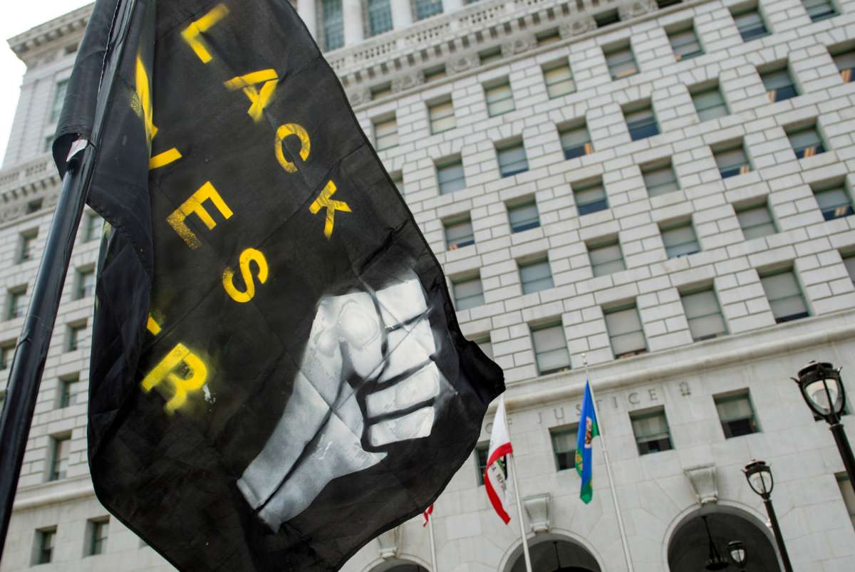A Black Lives Matter flag is set up in front of the Hall of Justice during a demonstration asking for the removal of District Attorney Jackie Lacey, in Los Angeles, California, on June 17, 2020.