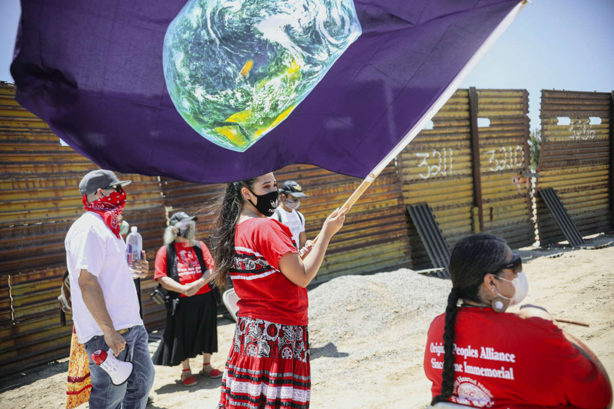 Members of the Kumeyaay Nation and demonstrators rally at the United States-Mexico border to protest construction of a new wall being constructed on their ancestral grounds on July 1, 2020, in Boulevard, California.