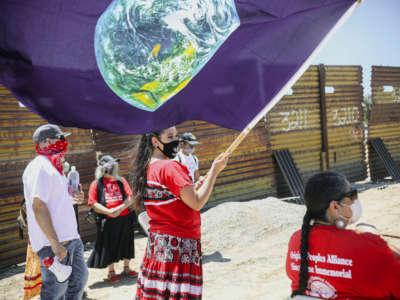 Members of the Kumeyaay Nation and demonstrators rally at the United States-Mexico border to protest construction of a new wall being constructed on their ancestral grounds on July 1, 2020, in Boulevard, California.