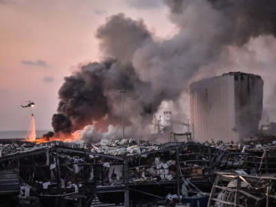 A military helicopter tries to put out a fire at the port after the explosion on August 4, 2020, in Beirut, Lebanon.