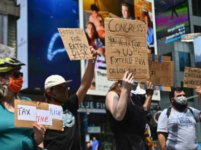 Protesters rally demanding economic relief during the coronavirus pandemic, at Time Square on August 5, 2020, in New York City.