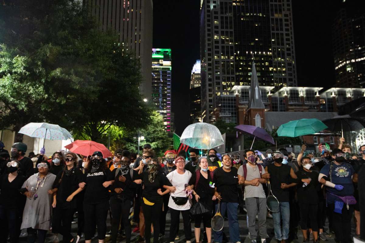 Protestors form a human chain during a protest, organized by Charlotte Uprising in uptown Charlotte near the site of the 2020 Republican National Convention in North Carolina on August 22, 2020.