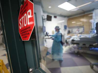 A nurse cares for a coronavirus patient in the Intensive Care Unit at El Centro Regional Medical Center in hard-hit Imperial County on July 28, 2020, in El Centro, California.