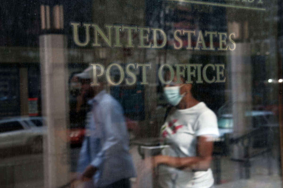 People enter a Brooklyn Post Office on August 5, 2020, in New York City.