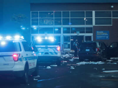 Police officers inspect a damaged Best Buy store on August 10, 2020, in Chicago, Illinois.