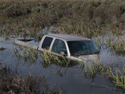 A vehicle is seen in a flooded area after Hurricane Laura passed through on August 29, 2020, in Creole, Louisiana.