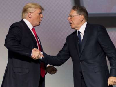 Donald Trump shakes hands with National Rifle Association (NRA) President Wayne LaPierre during the NRA Leadership Forum in Atlanta, Georgia, on April 28, 2017.c