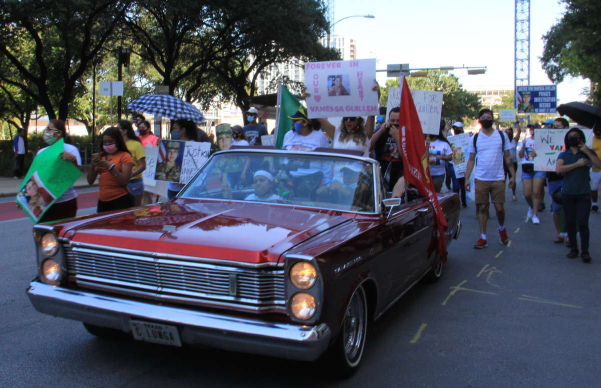 Vanessa Guillén's mother, Gloria Guillén, in the passenger seat of a low-rider during a march to the Texas Capitol building in Austin in support of the family's forthcoming #IamVanessaGuillén bill, on September 7, 2020.