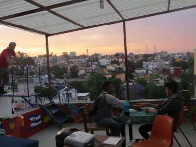 Migrants on the roof of the Casa Tochan shelter, in Mexico City, passing time during pandemic lockdown.