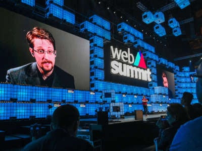 Edward Snowden is seen onscreen while speaking from Russia to the audience during an interview on the opening night of Web Summit in Altice Arena on November 4, 2019, in Lisbon, Portugal.