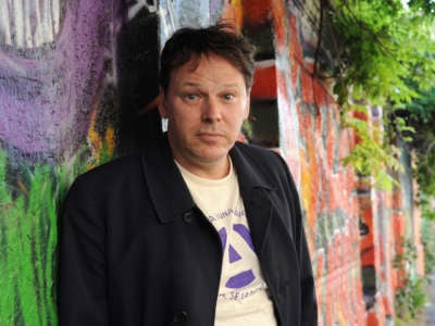 David Graeber poses for a photo at an Occupy Movement public debate on June 13, 2012, in Milan, Italy.