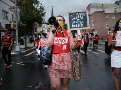 UFT members, parents and students participate in a march through Brooklyn to demand a safer teaching environment for themselves and for students during the COVID-19 pandemic on September 1, 2020, in New York City.