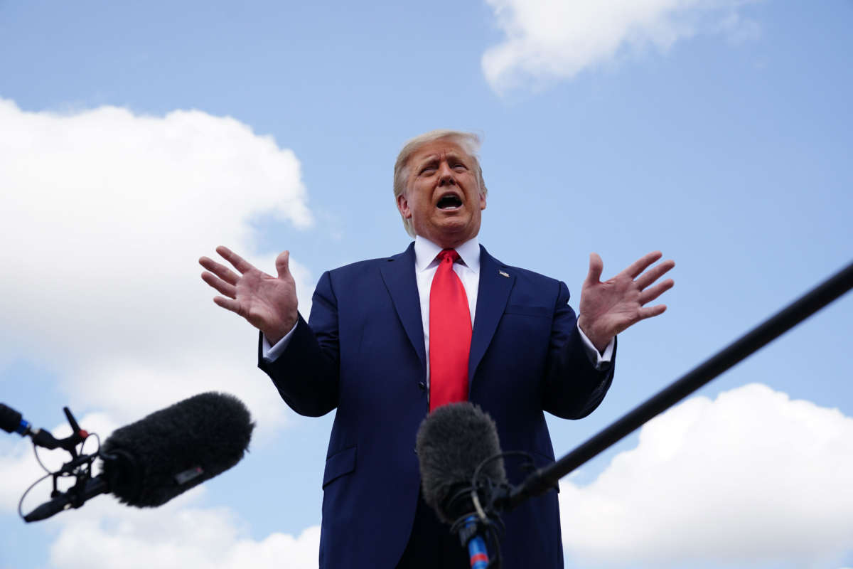 President Trump speaks as he makes his way to board Air Force One before departing from Andrews Air Force Base in Maryland on September 8, 2020.