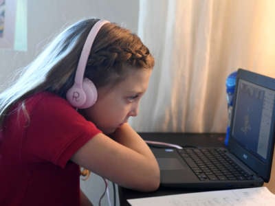 Doral Academy Red Rock Elementary School fourth grader Reaghan Keeler, 9, attends an online reading class in her bedroom on her first day of distance learning on August 24, 2020, in Las Vegas, Nevada.