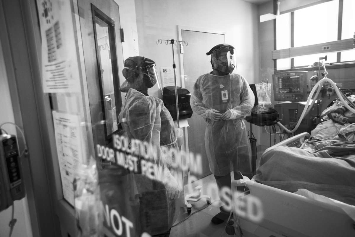 An ICU nurse and doctor work together in the ICU with a COVID-19 positive patient at Martin Luther King, Jr. Community Hospital on May 6, 2020, in South Los Angeles, California.