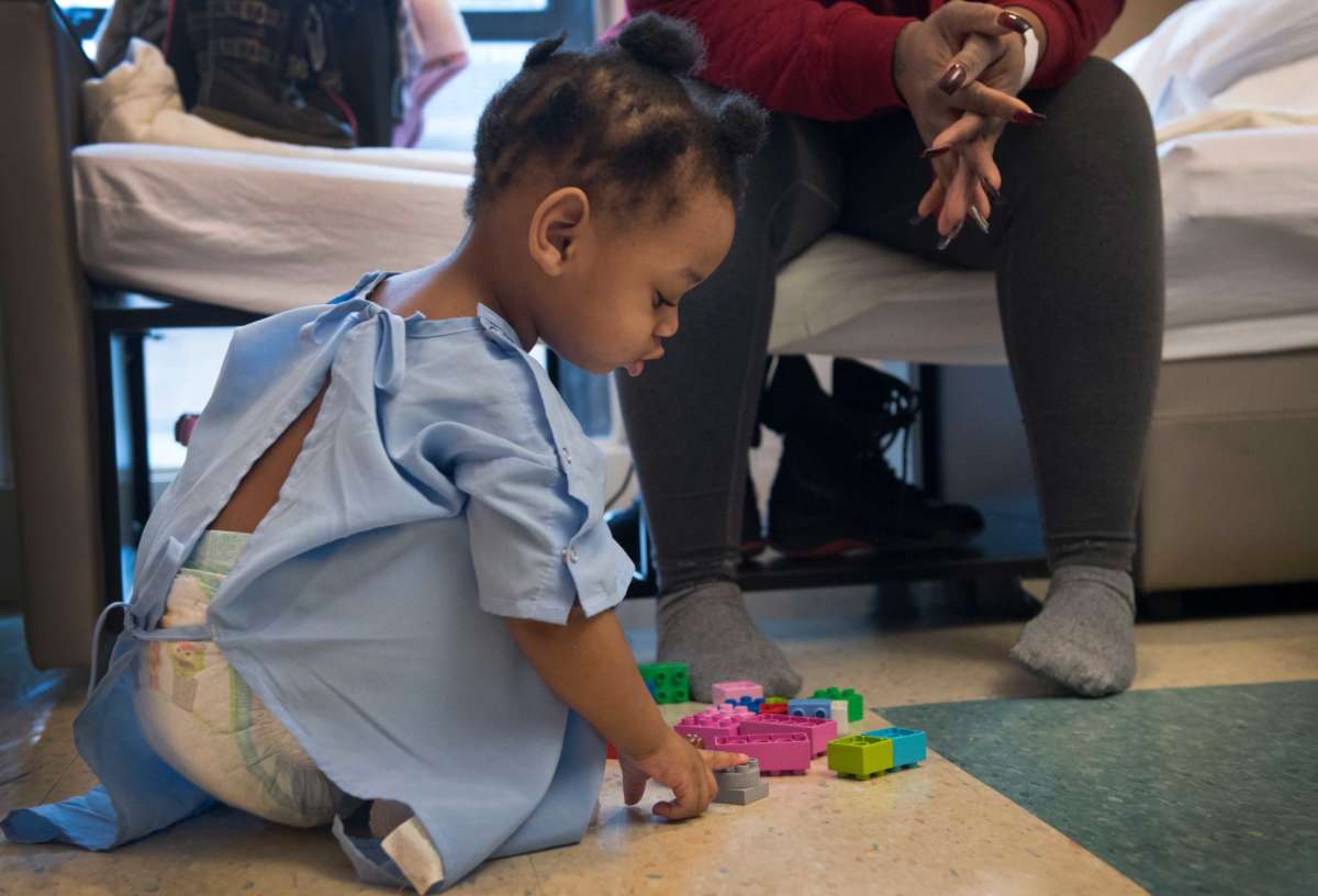 Crystal Luster with her two-year-old daughter Heavenz who is being treated for lead poisoning at Children's Hospital in Washington, D.C., on January 13, 2017.