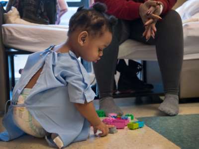 Crystal Luster with her two-year-old daughter Heavenz who is being treated for lead poisoning at Children's Hospital in Washington, D.C., on January 13, 2017.