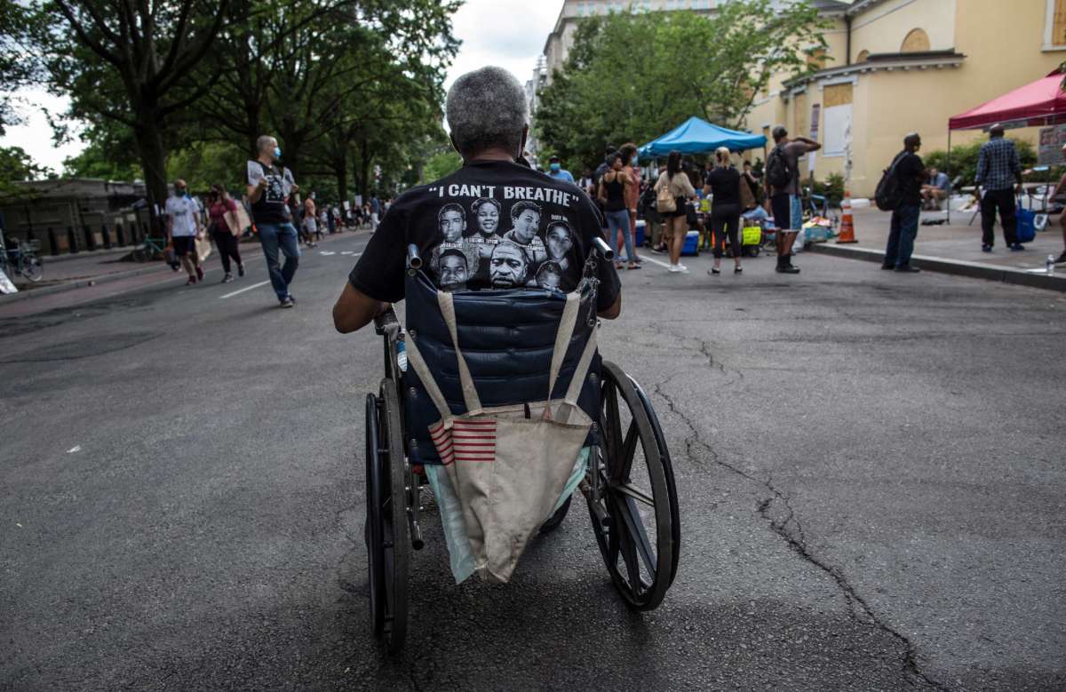 A man in a wheelchair takes part in a demonstration near the White House while protesting against police brutality and racism in Washington D.C., June 13, 2020.