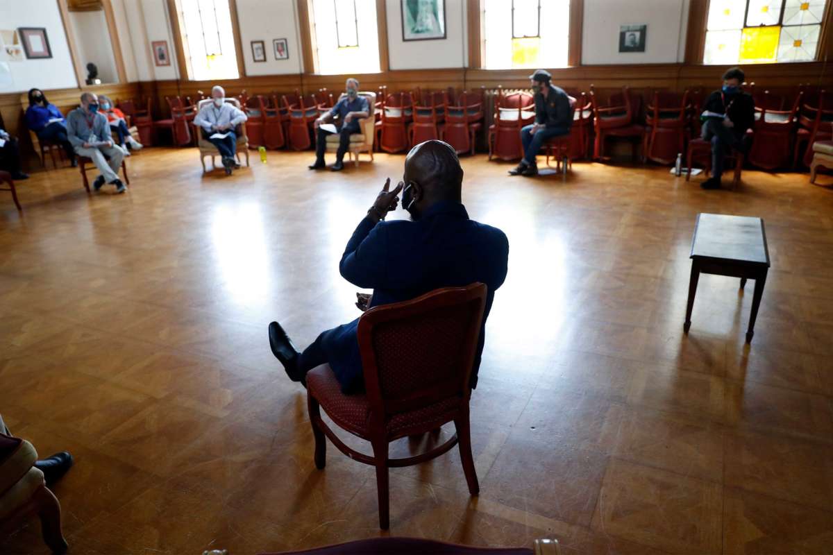 James Dixon, HealthRIGHT 360 Director of Residential Services, leads a staff meeting at the residential drug treatment program in San Francisco, California, on May 20, 2020.