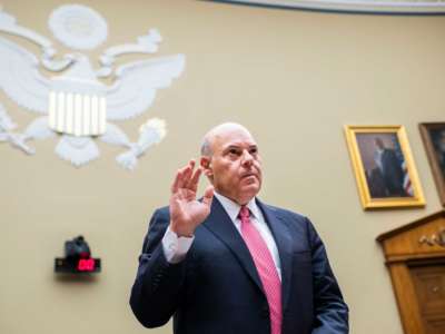 Postmaster General Louis DeJoy is sworn into a House Oversight and Reform Committee hearing in the Rayburn House Office Building on August 24, 2020.