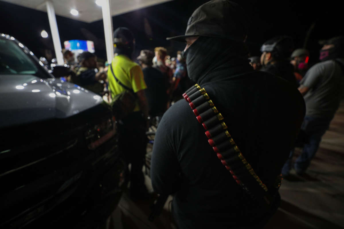 Armed civilians stand in the streets of Kenosha during third day of protests over the shooting of Jacob Blake by a police officer in Wisconsin, August 25, 2020.