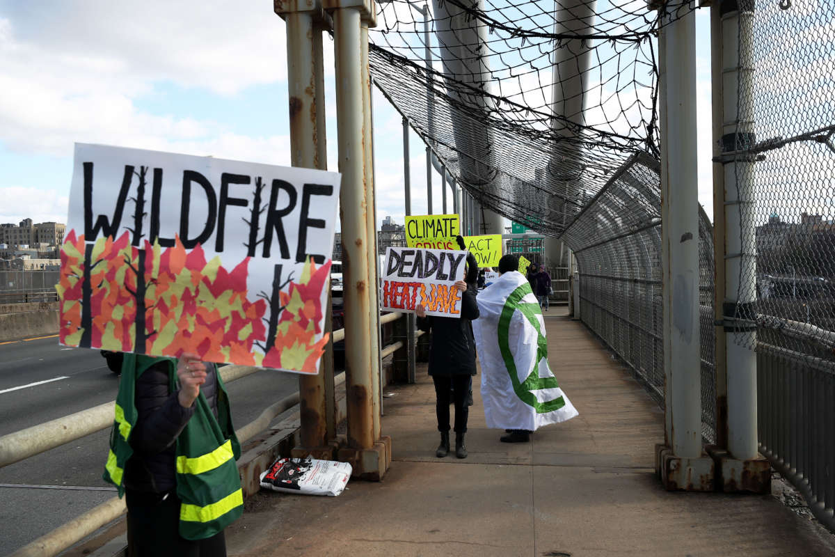 Activists for climate action walk along the George Washington Bridge from New York City to New Jersey on January 26, 2020.