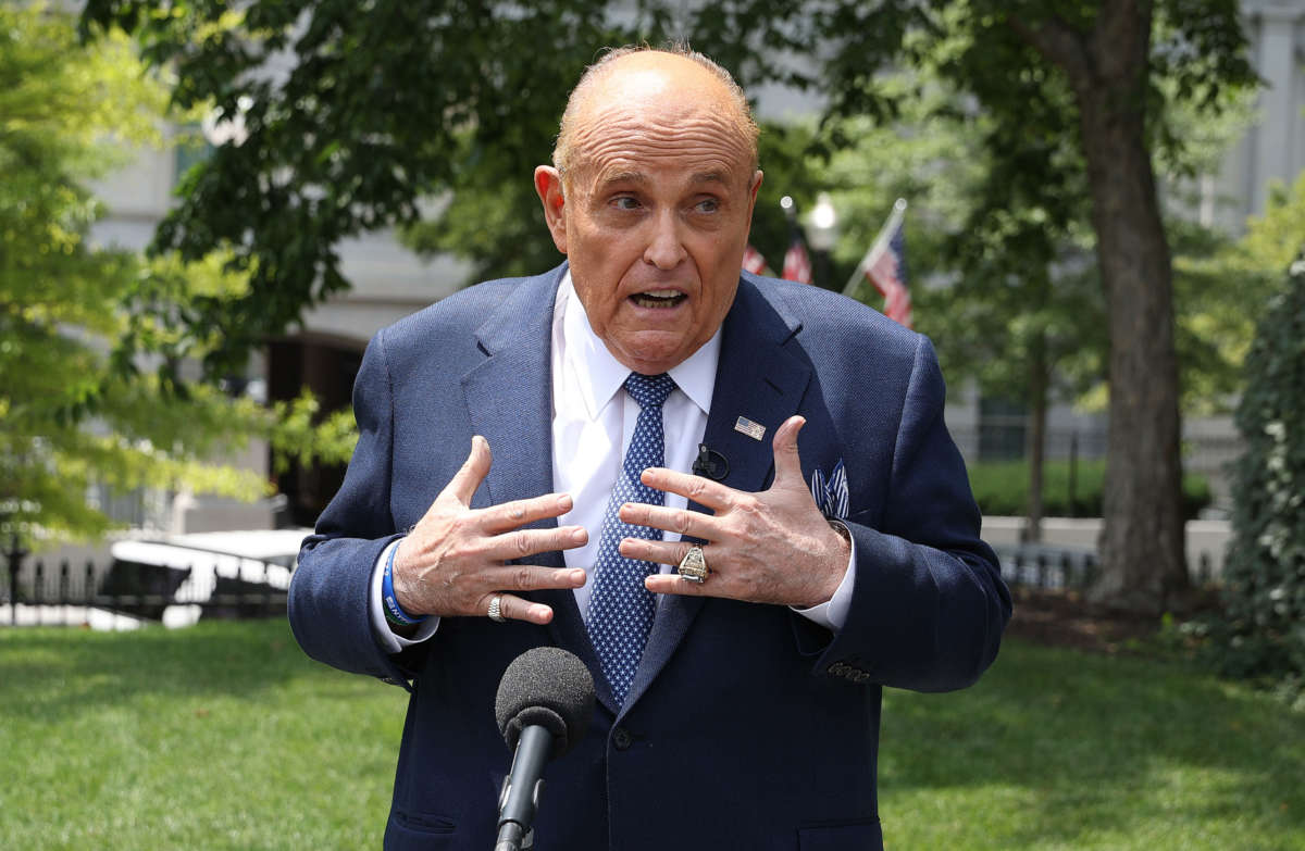 President Trump's lawyer and former New York City Mayor Rudy Giuliani talks to journalists outside the White House, July 1, 2020, in Washington, D.C.