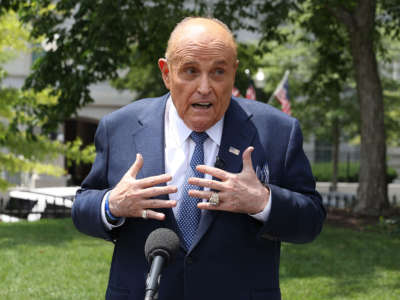 President Trump's lawyer and former New York City Mayor Rudy Giuliani talks to journalists outside the White House, July 1, 2020, in Washington, D.C.